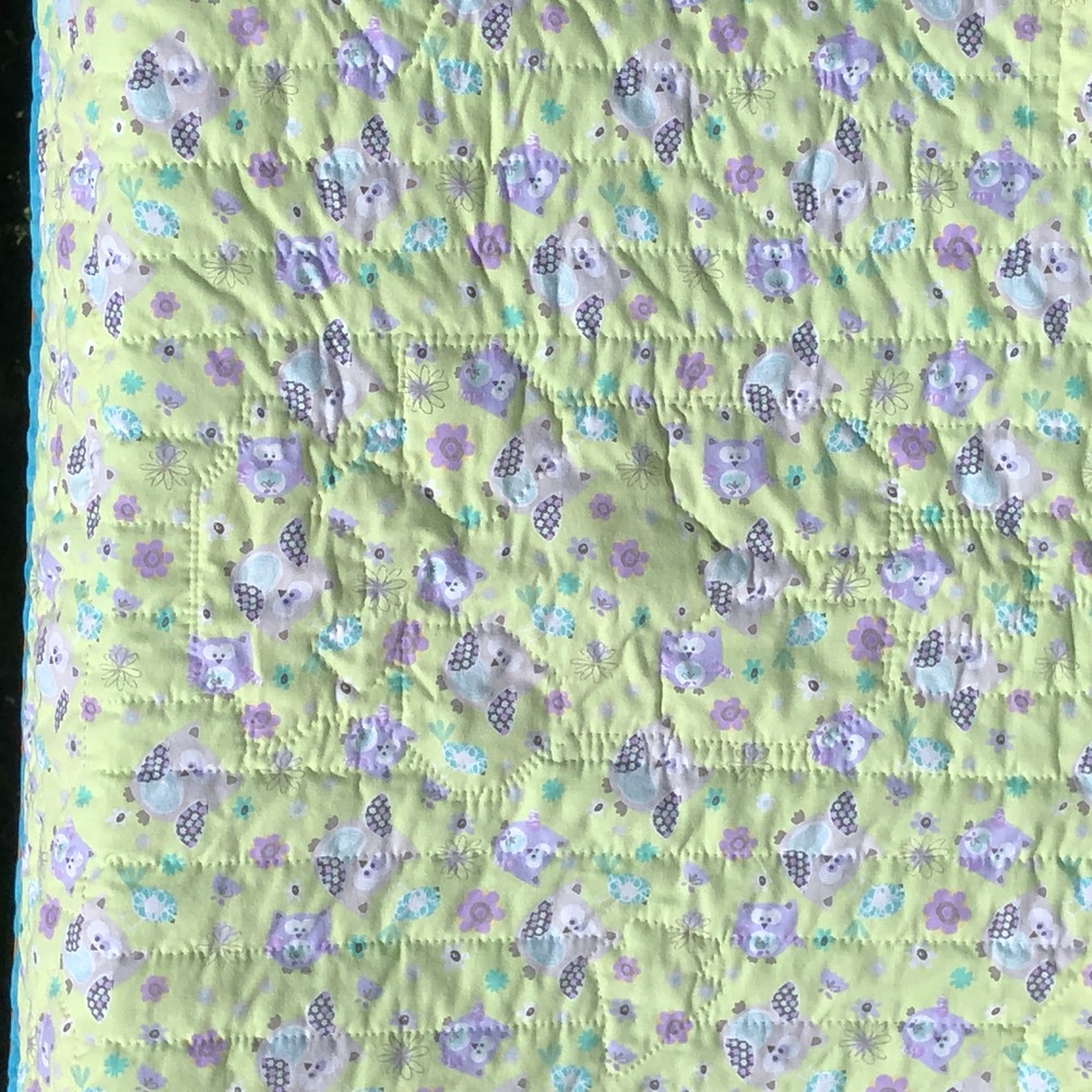A closeup of the backing fabric showing cute owls
