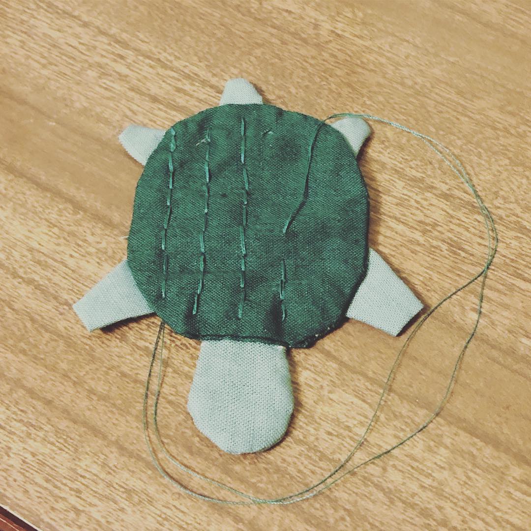 A work-in-progress photo of the turtle. I’m stitching along the top of its shell in one direction.