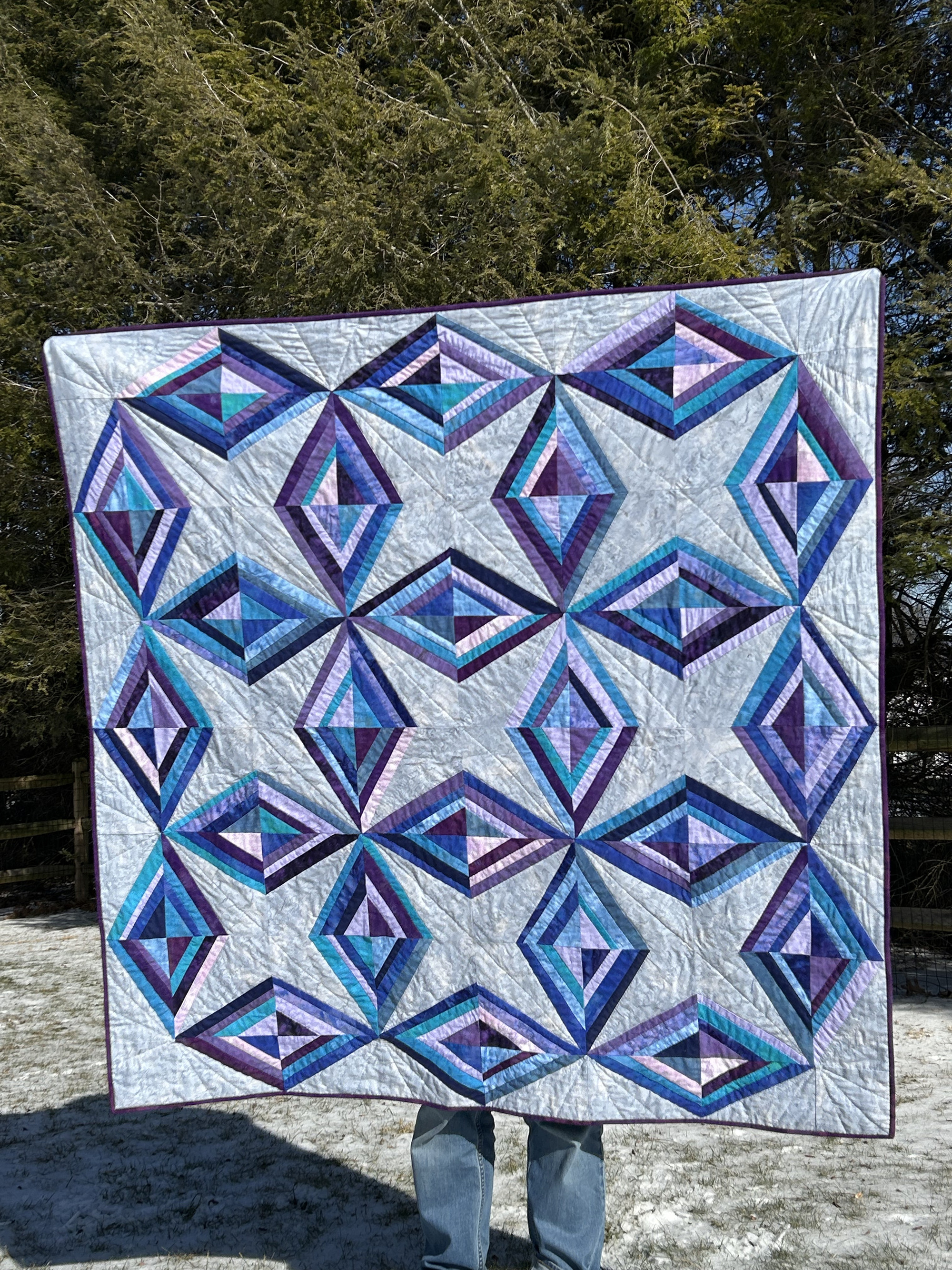 Closeup of the quilt. This shows quilting in the gray areas diagonally, creating an additional radiant effect with significantly more radials on the outer edge.