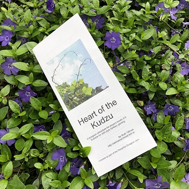 Heart of the Kudzu pamphlet printed and lying on a bed of vines